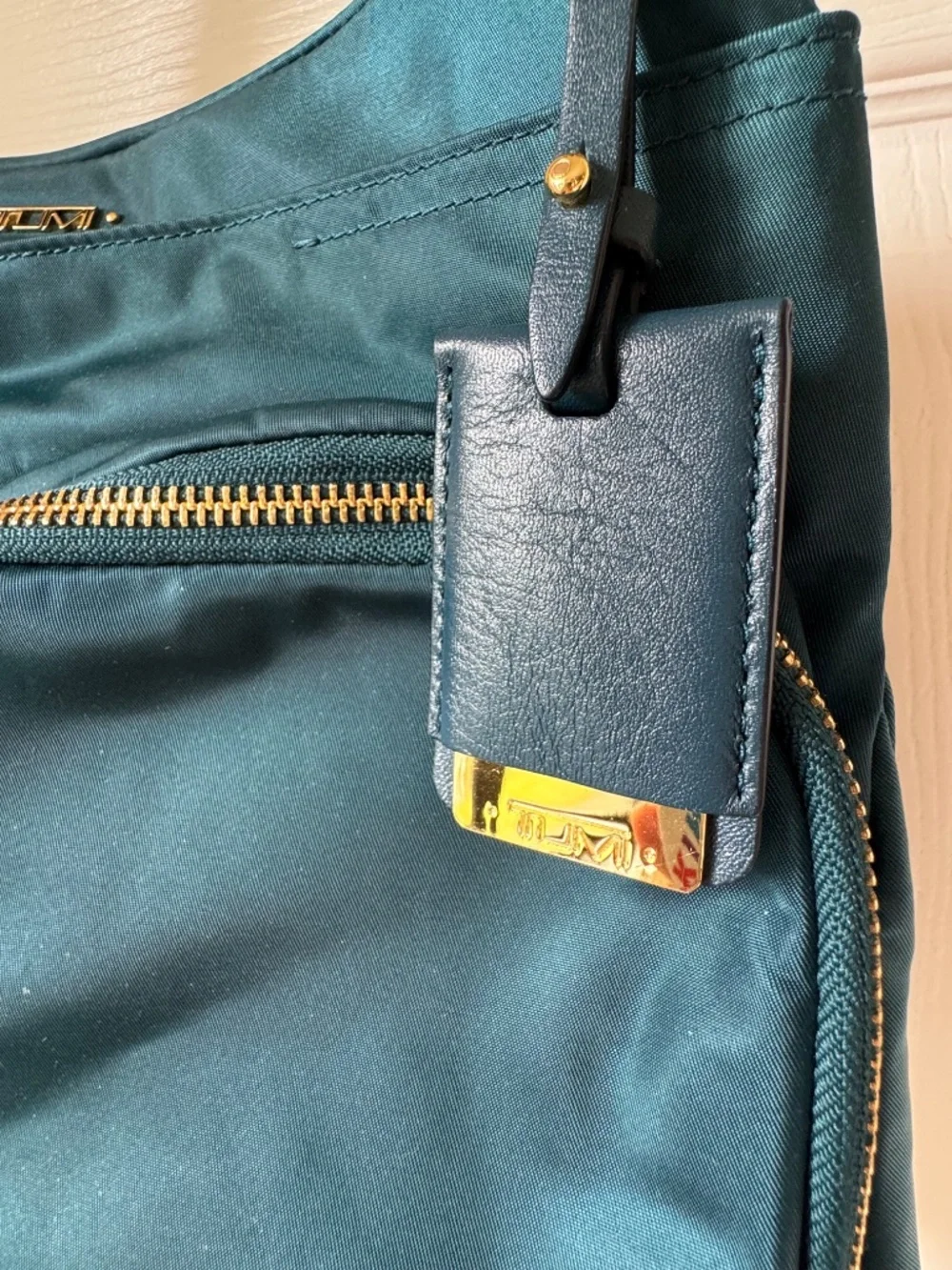TUMI Voyageur Sadler Teal Blue Nylon Crossbody Bag Gold Hardware